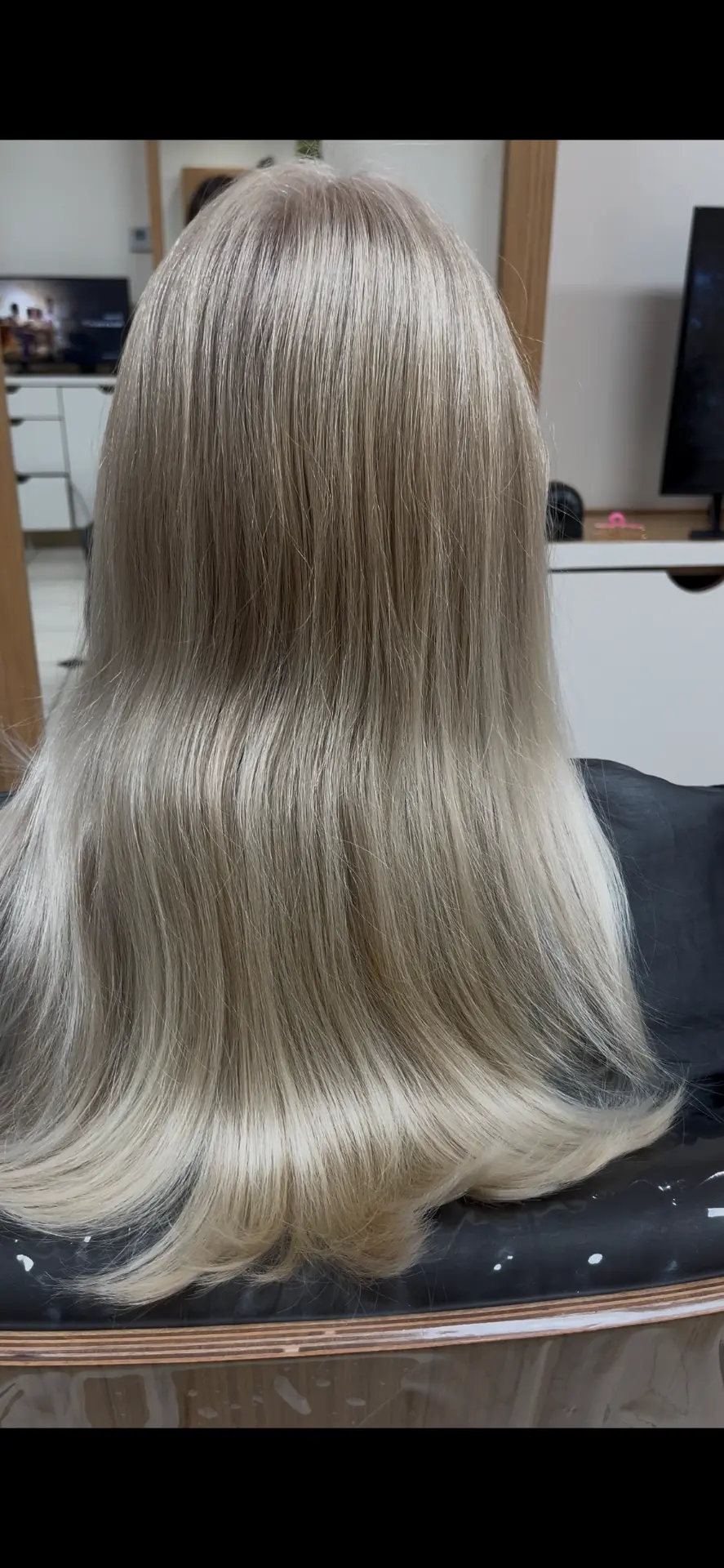 After: smooth, even ash blonde blowout with soft dimension at Dass Hair Salon, Carrollton, Texas